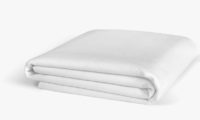 Folded mattress protector against a white background.